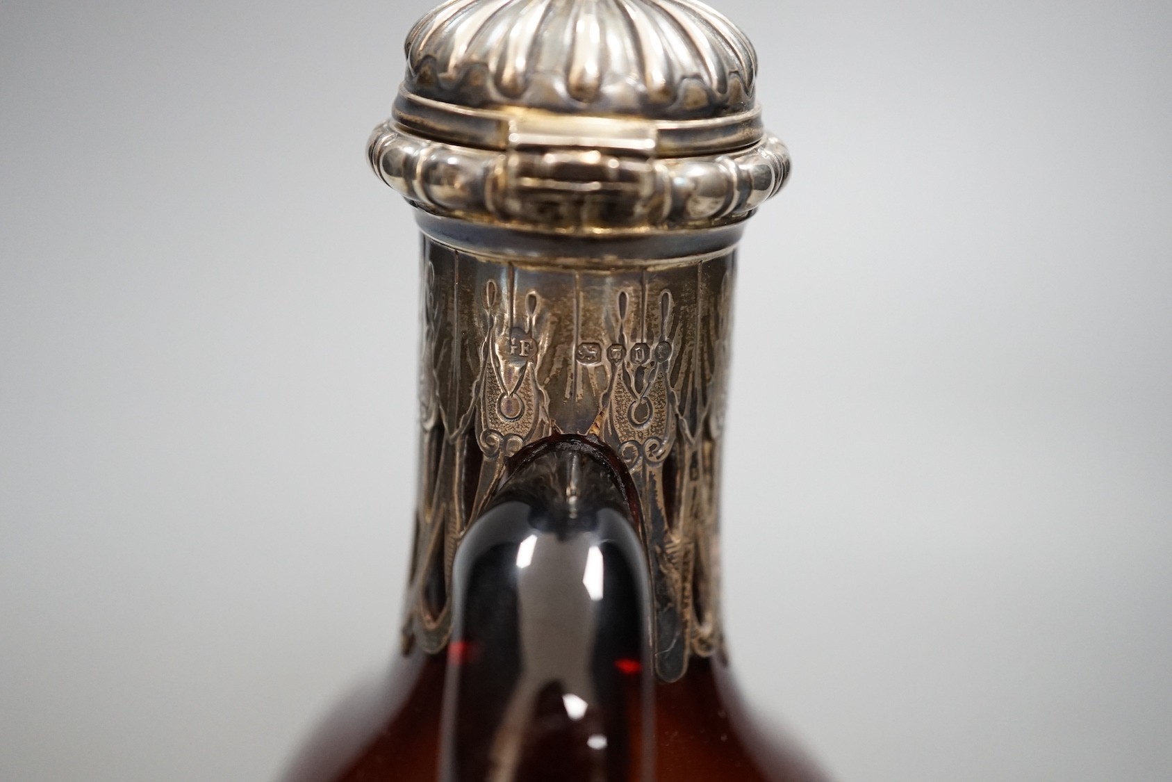 A Victorian silver mounted amber glass hock jug, by George Fox, London 1869, 20cm tall